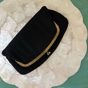 Vintage black textured fabric clutch with gold metal frame and clasp